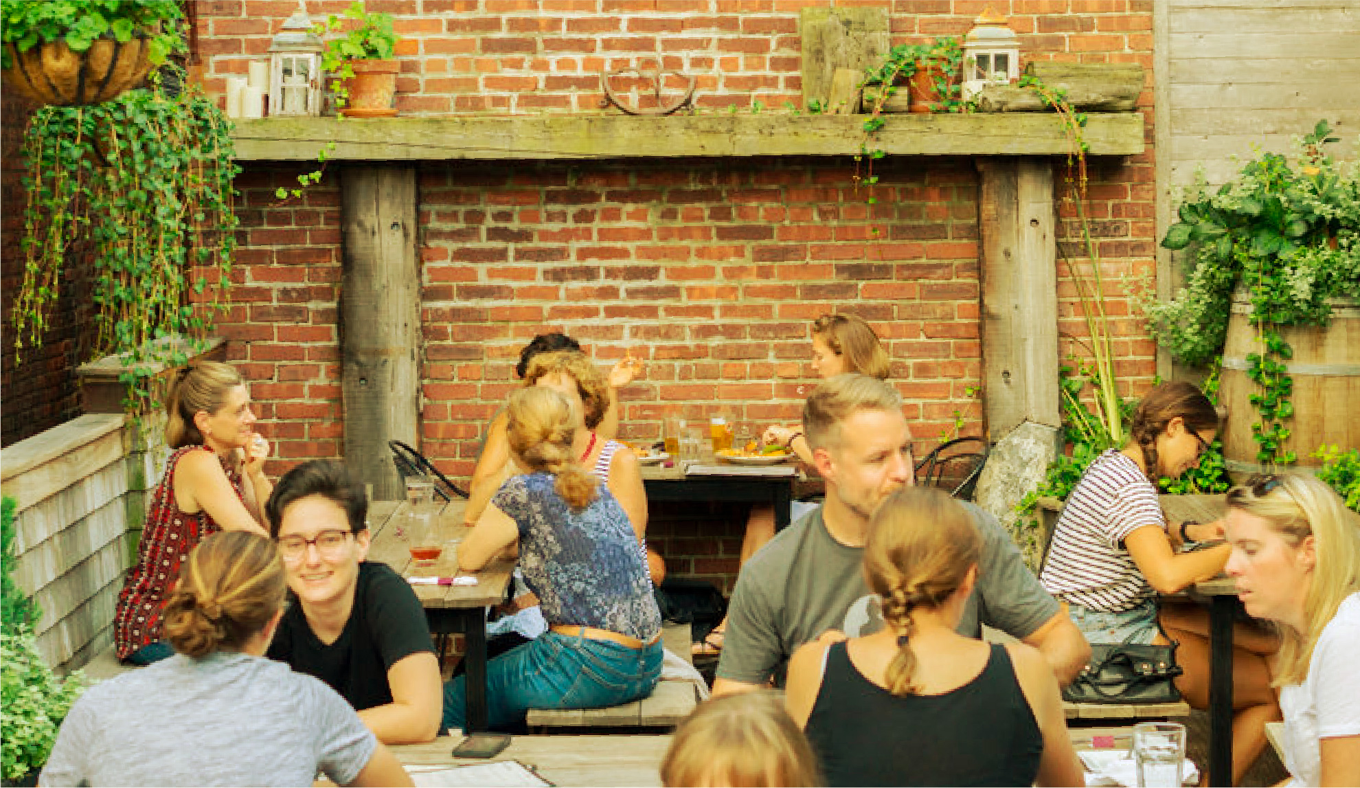 People enjoying a few drinks outside on a patio in Boston