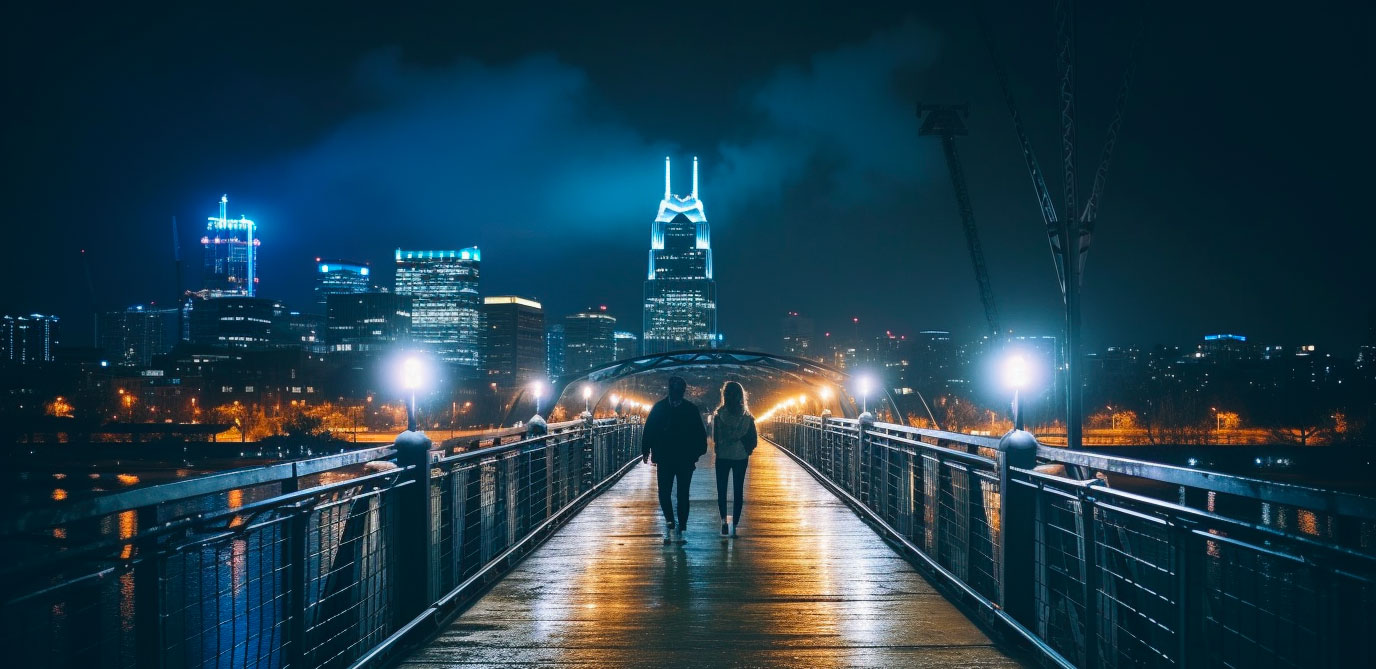 A couple walking on Nashville's Cumberland Pedestrian Bridge